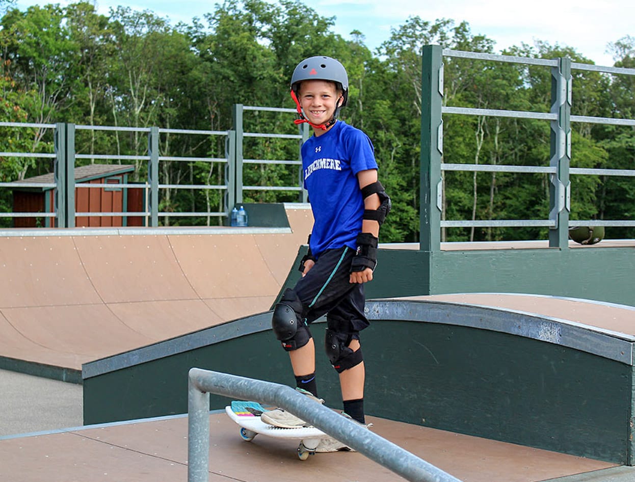 boy camper skateboarding